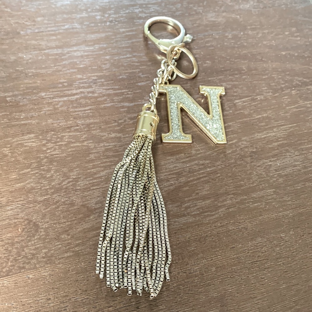 Purse charm with golden metal tassel and bling letter N